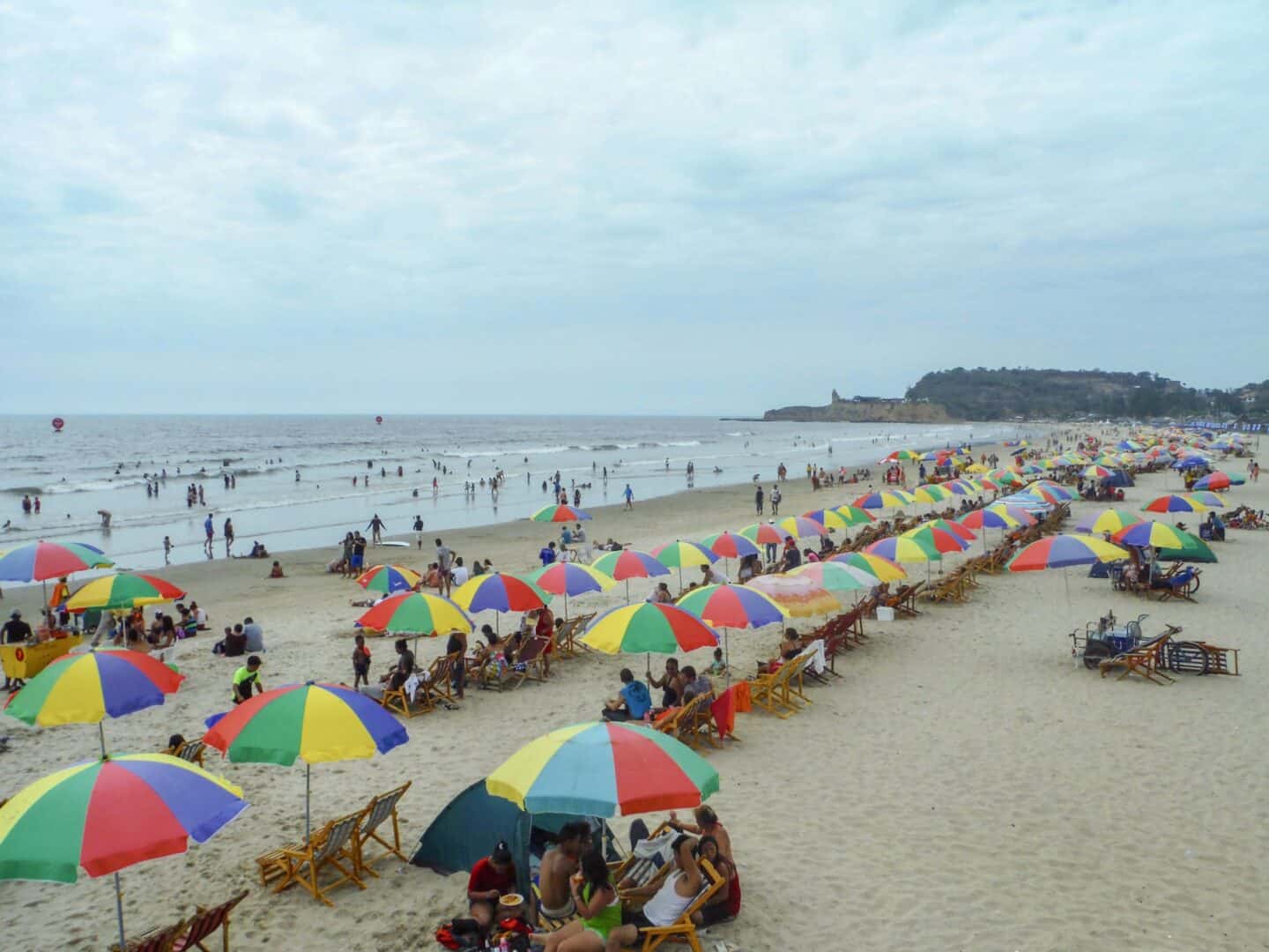 Ecuador Itinerary, Montanita Beach very busy with umbrellas