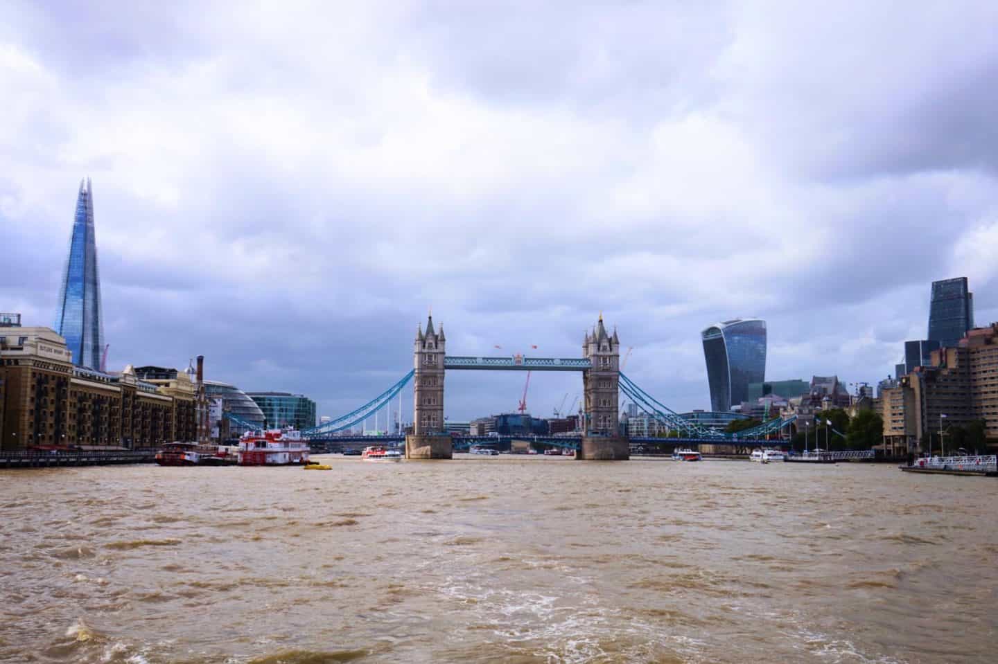 Cloudy and Rainy Skies on River Thames in London with Tower Bridge and Shard showing