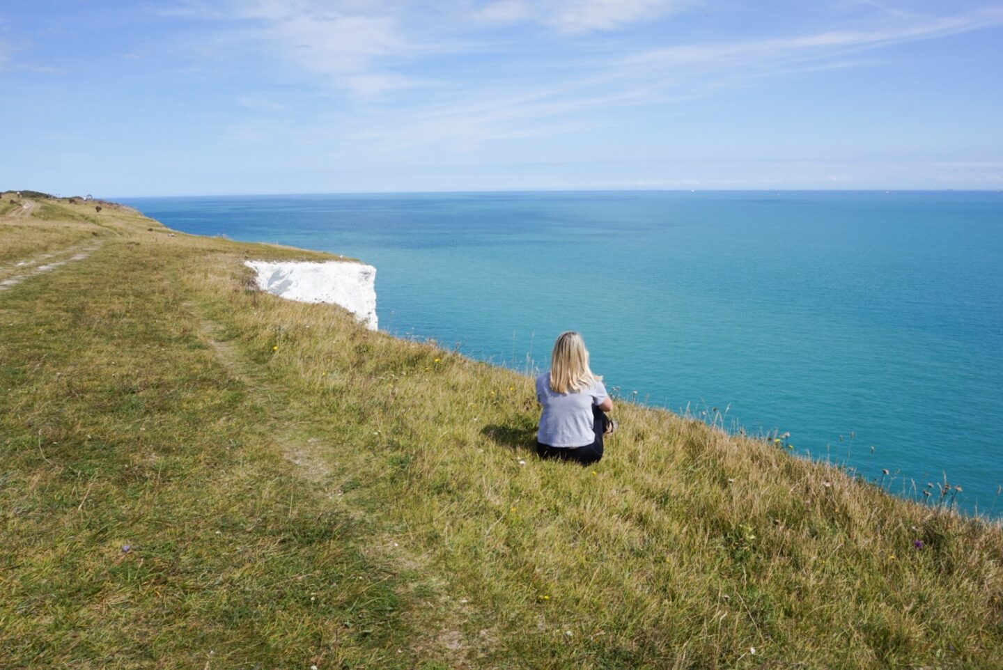white cliffs of dover from London, woman at the white cliffs of dover