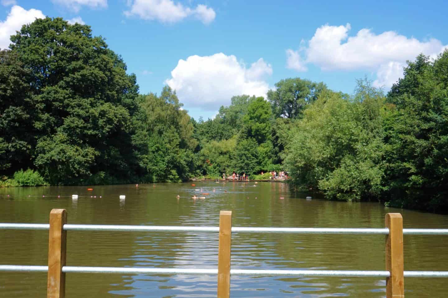 Hampstead Heath mixed swimming pond with railing in front | what to do on Hampstead Heath