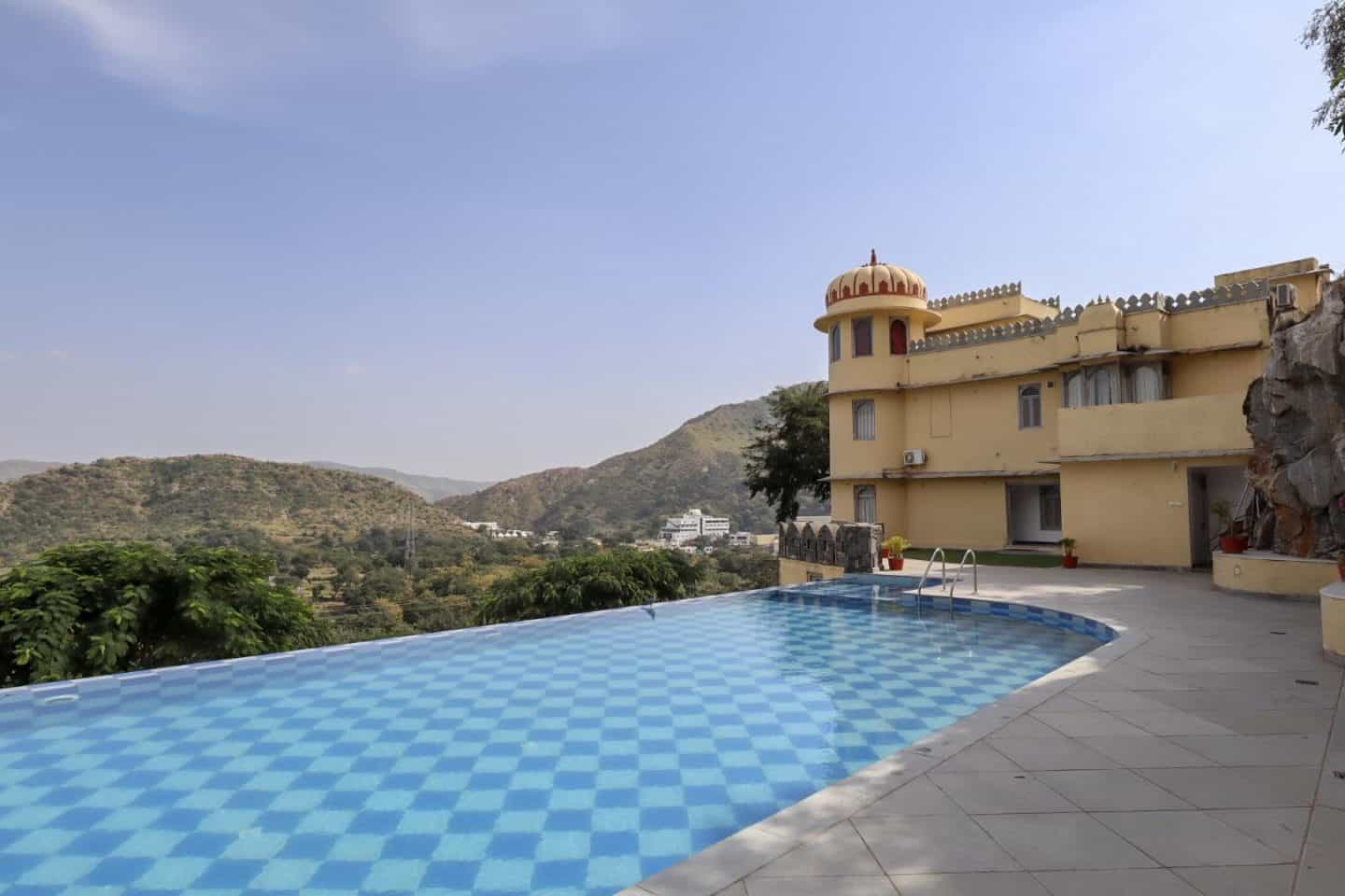 swimming pool and mountains at Shahpura Kumbhal | best places to visit in India