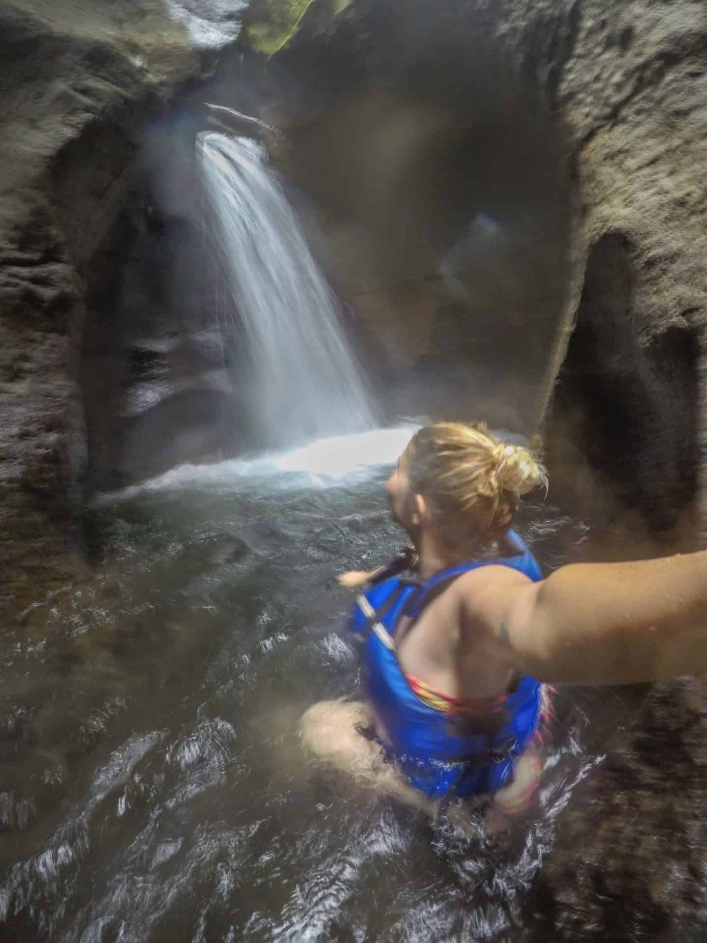dominica day tours, titou gorge waterfall ellie quinn in blue lifejacket 