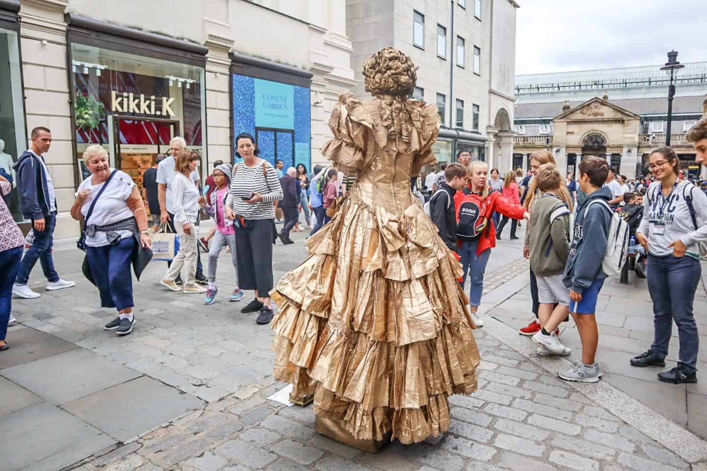 covent garden women street performer in dress covered in gold | covent garden london guide
