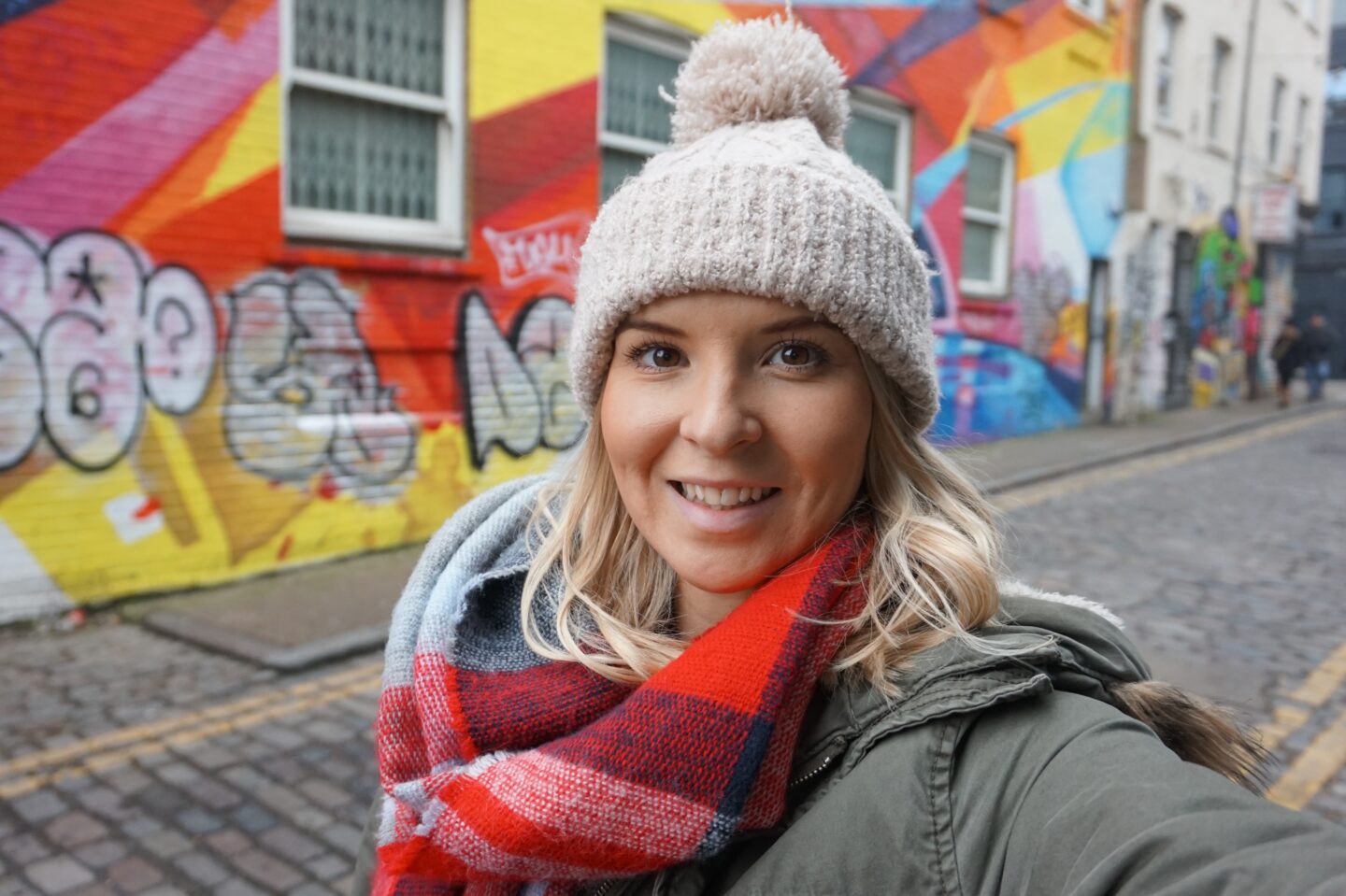 London in Winter, ellie quinn in woolly hat with street art