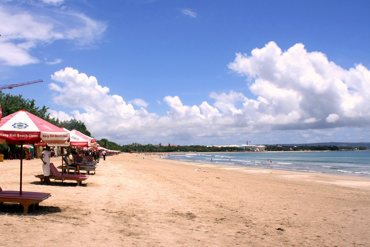 Bali Lombok itinerary, Kuta Beach Bali with beach chairs 