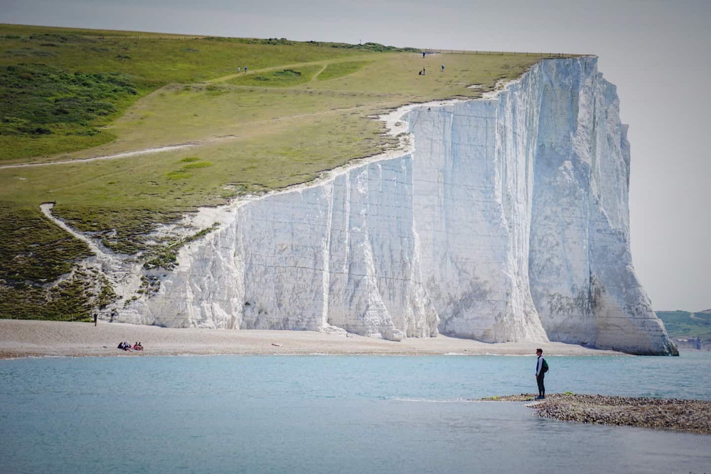 Seven Sisters White Cliffs and Person standing below | Seven Sisters day trip from London by train