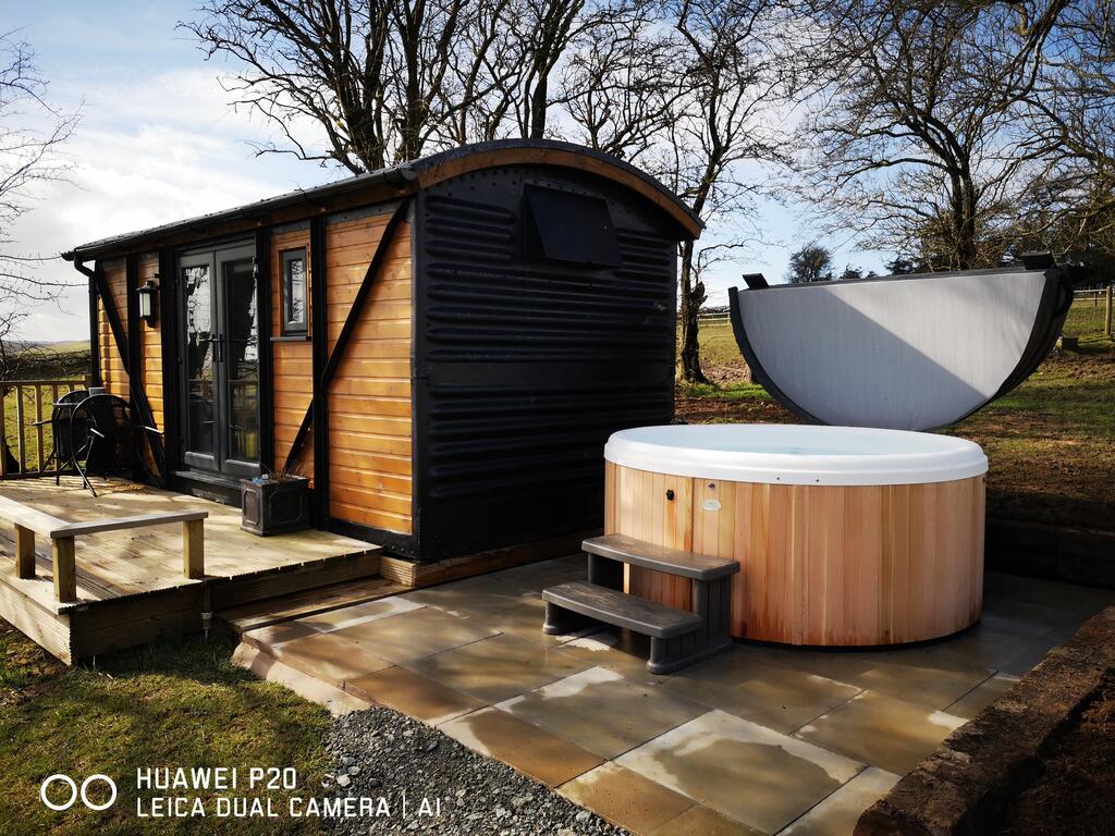 The Hare Hut outside with hot tub, glamping pod with hot tub wales