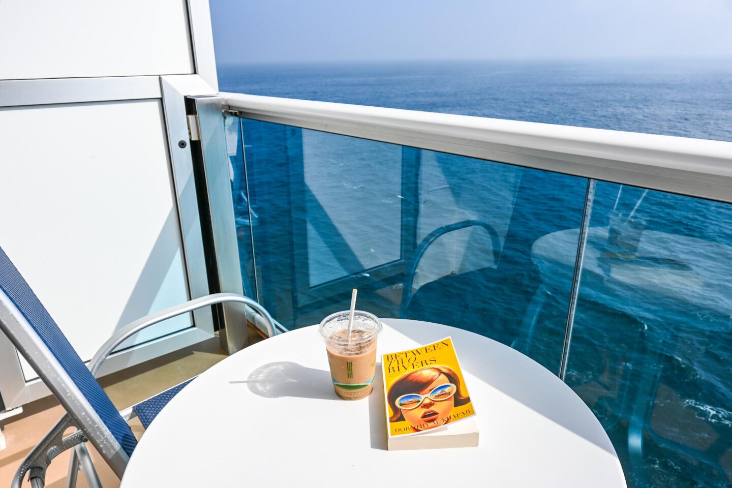 Princess Cruises from Southampton, ice coffee and book on balcony