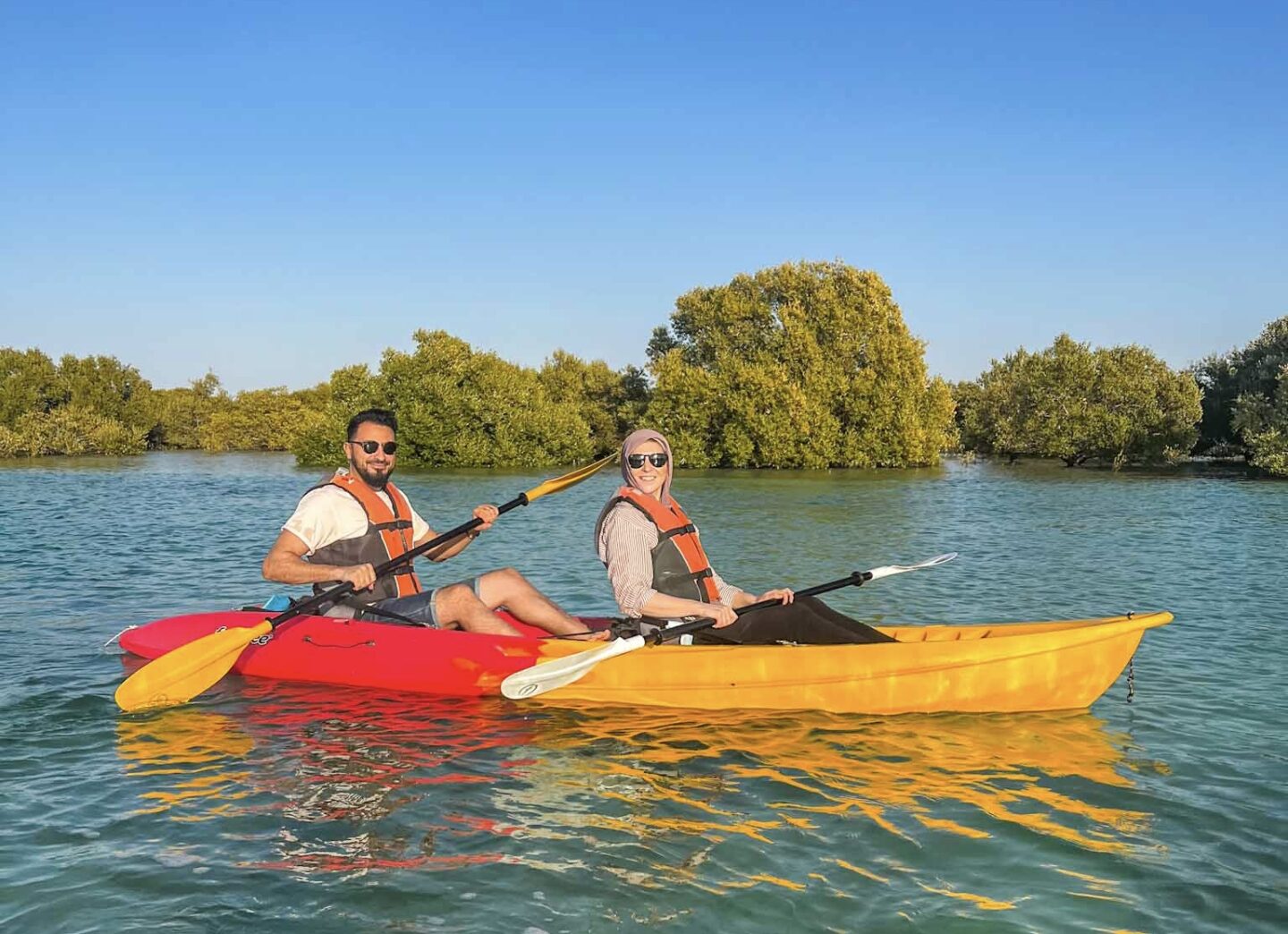 Things to do in Abu Dhabi, couple kayaking in Abu Dhabi
