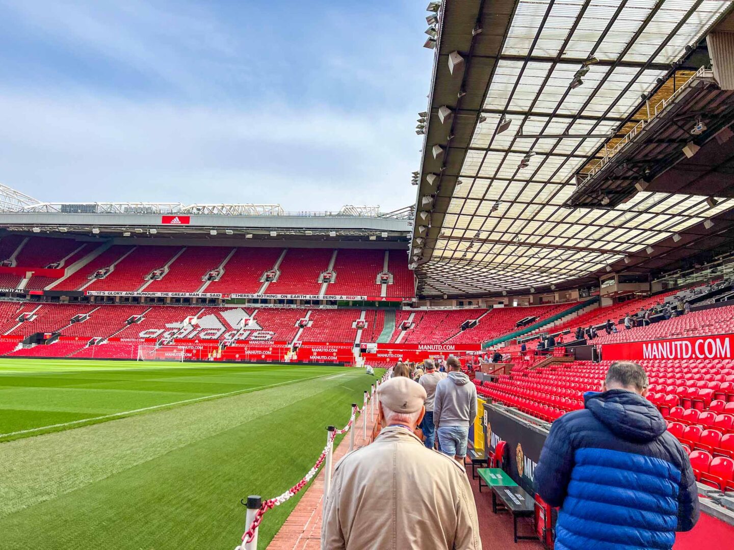 The Wandering Quinn Travel Blog Manchester United Stadium Tour, walking up side of pitch on tour