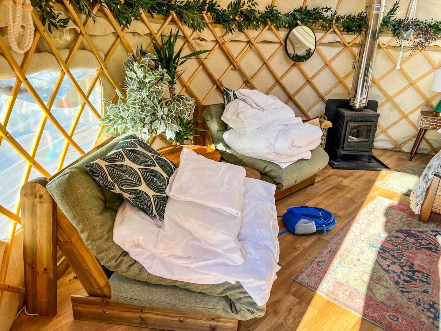The Wandering Quinn Travel Blog Glamping in Yorkshire, sofa beds inside Yurt at Yurtshire