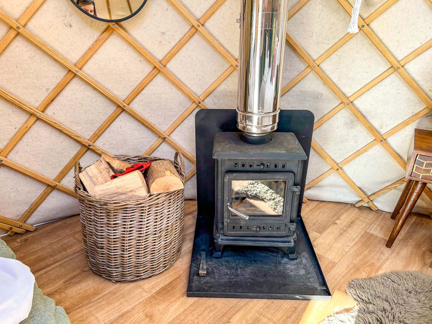 The Wandering Quinn Travel Blog Glamping in Yorkshire, wood burner inside Yurt at Yurtshire