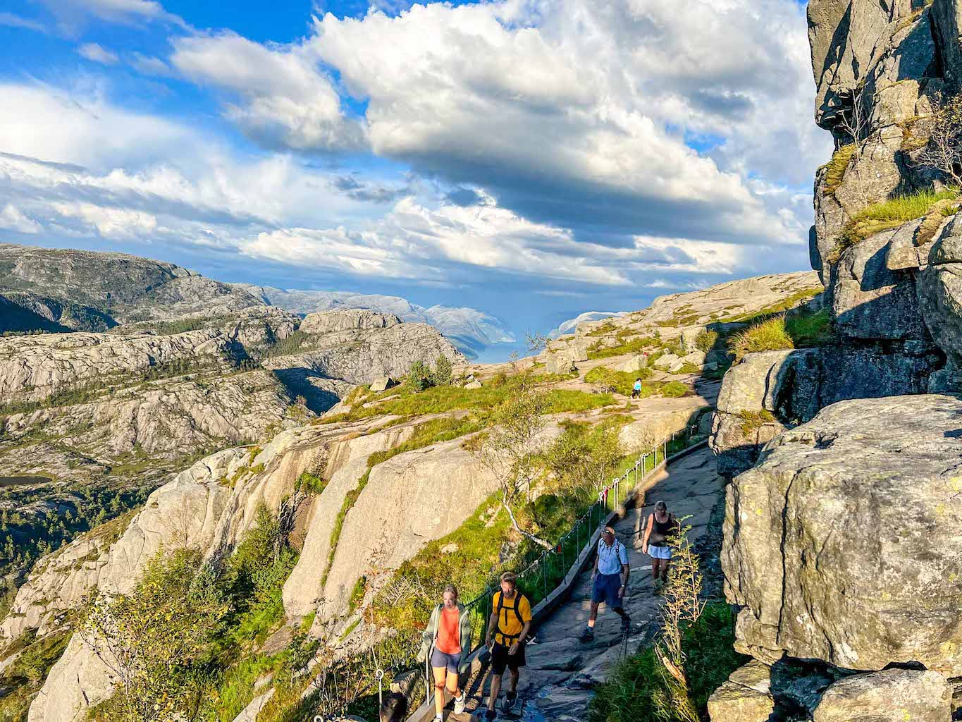 Pulpit Rock hike, Preikestolen hiking trail climbers over rock
