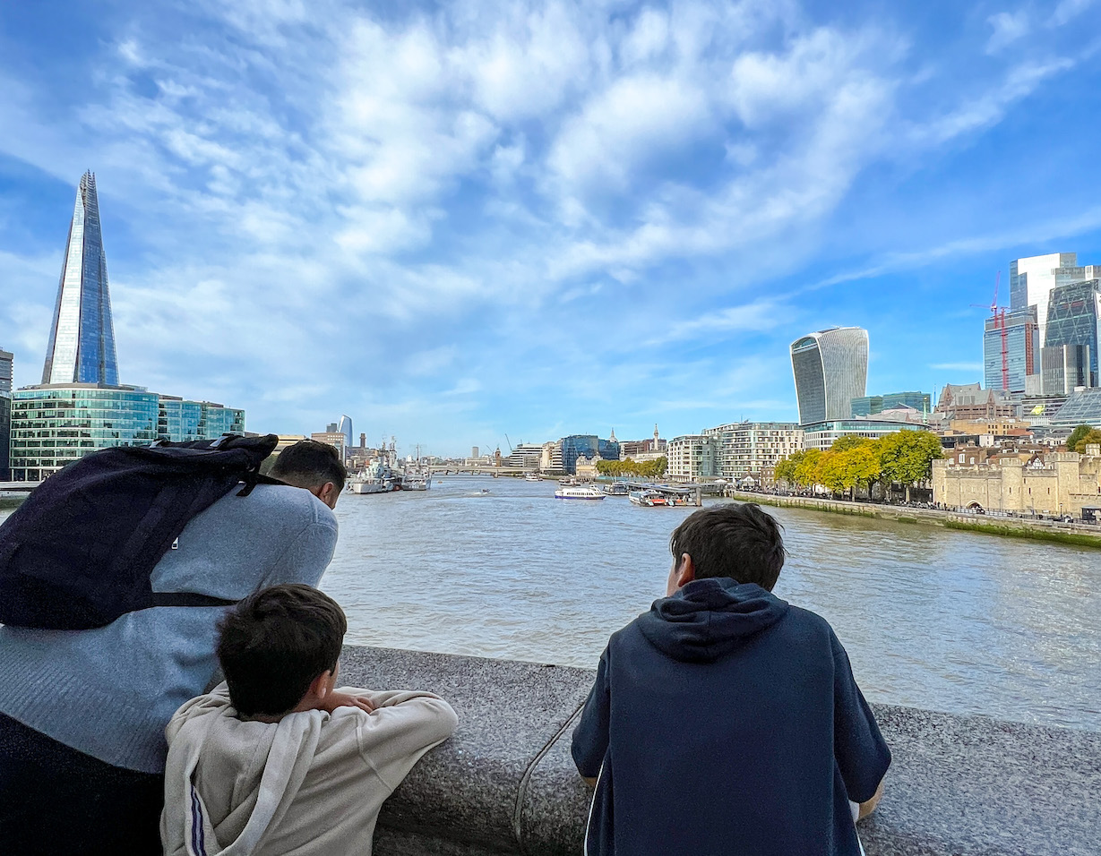 boys and dad looking over river thames, London with kids, London with kids itinerary,
