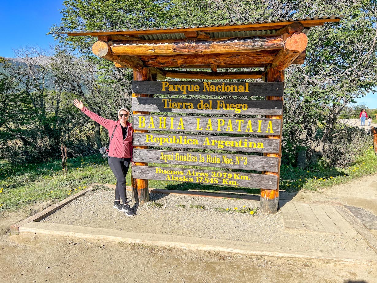 things to do in Ushuaia, Ellie at Tierra del Fuego National Park sign
