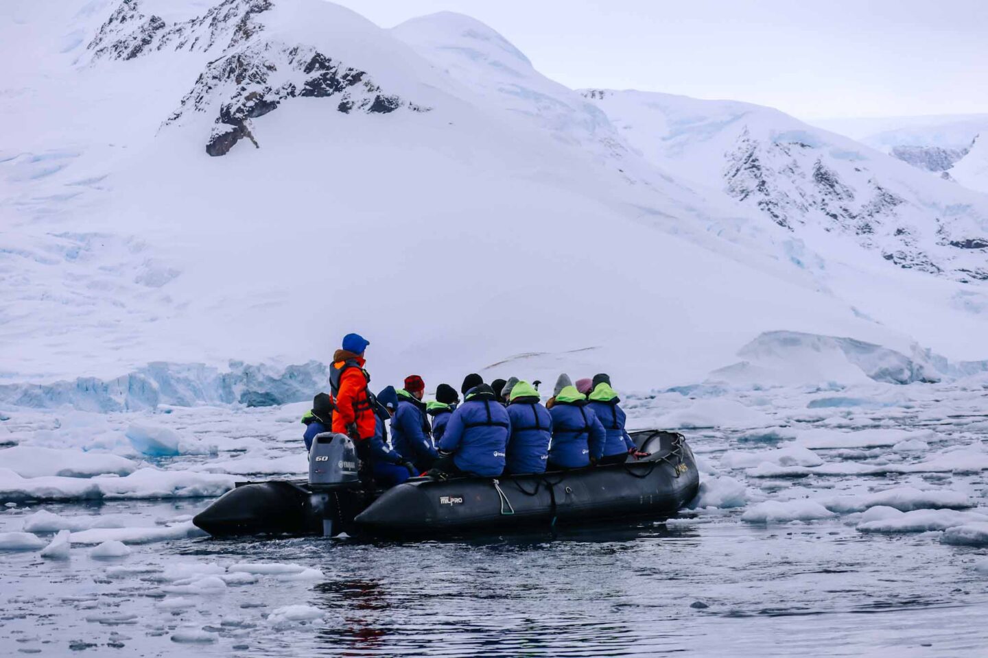 group on zodiac in Antarctica from afar, What to wear in Antarctica, What to pack for Antarctica,