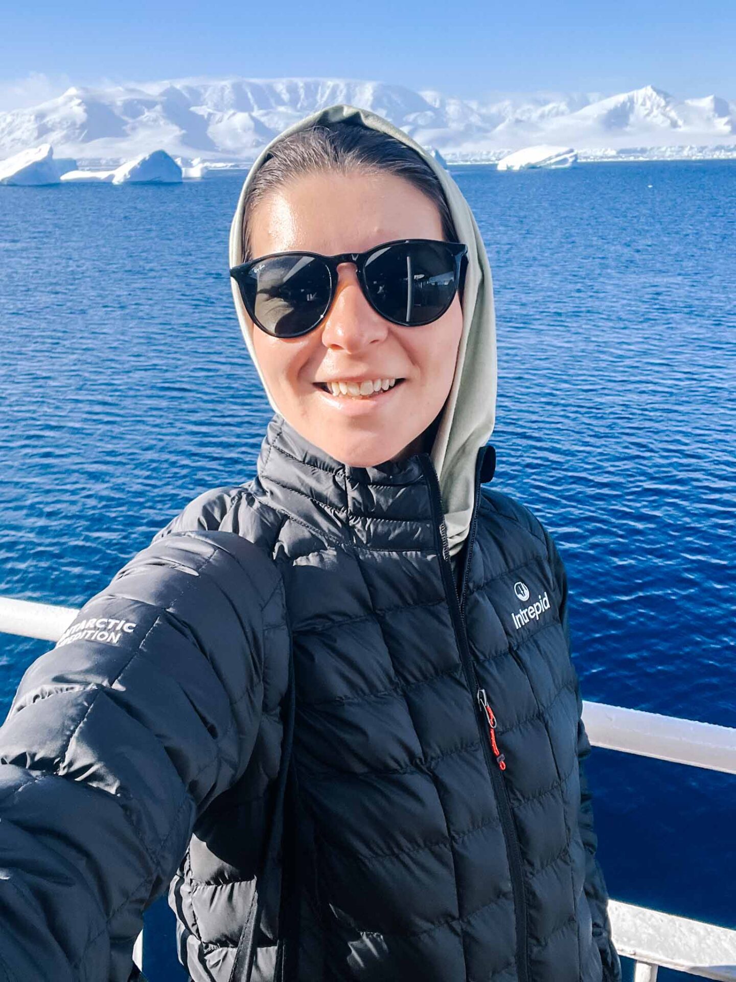 Ellie in down jacket in Antarctica, What to wear in Antarctica, What to pack for Antarctica,