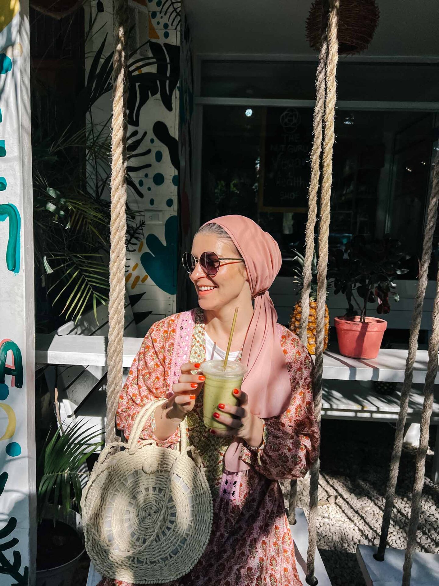 Ellie at Matcha Mama in Tulum with smoothie, Yucatan Road Trip, 1 week Mexico itinerary,