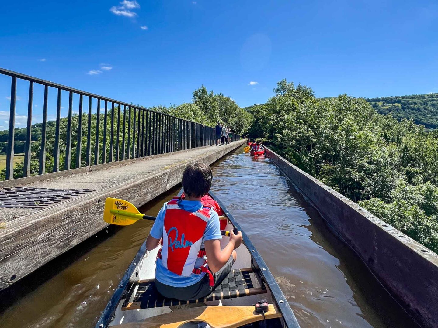 The Wandering Quinn Travel Blog best places to visit in Wales, boy canoeing over Pontcysyllte aqueduct 