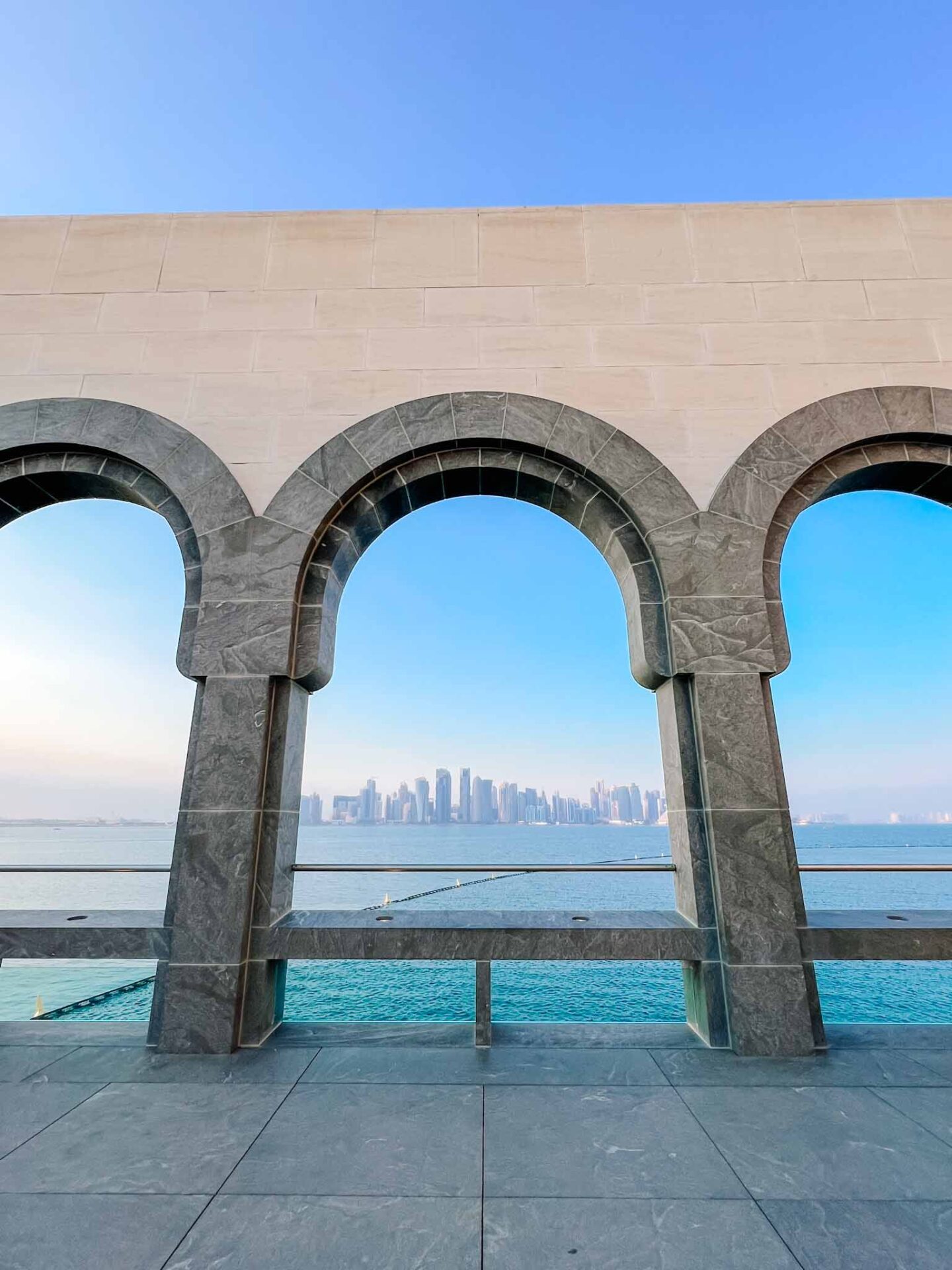 Doha city skyline view from arches in museum of Islamic art, Doha itinerary, Qatar itinerary