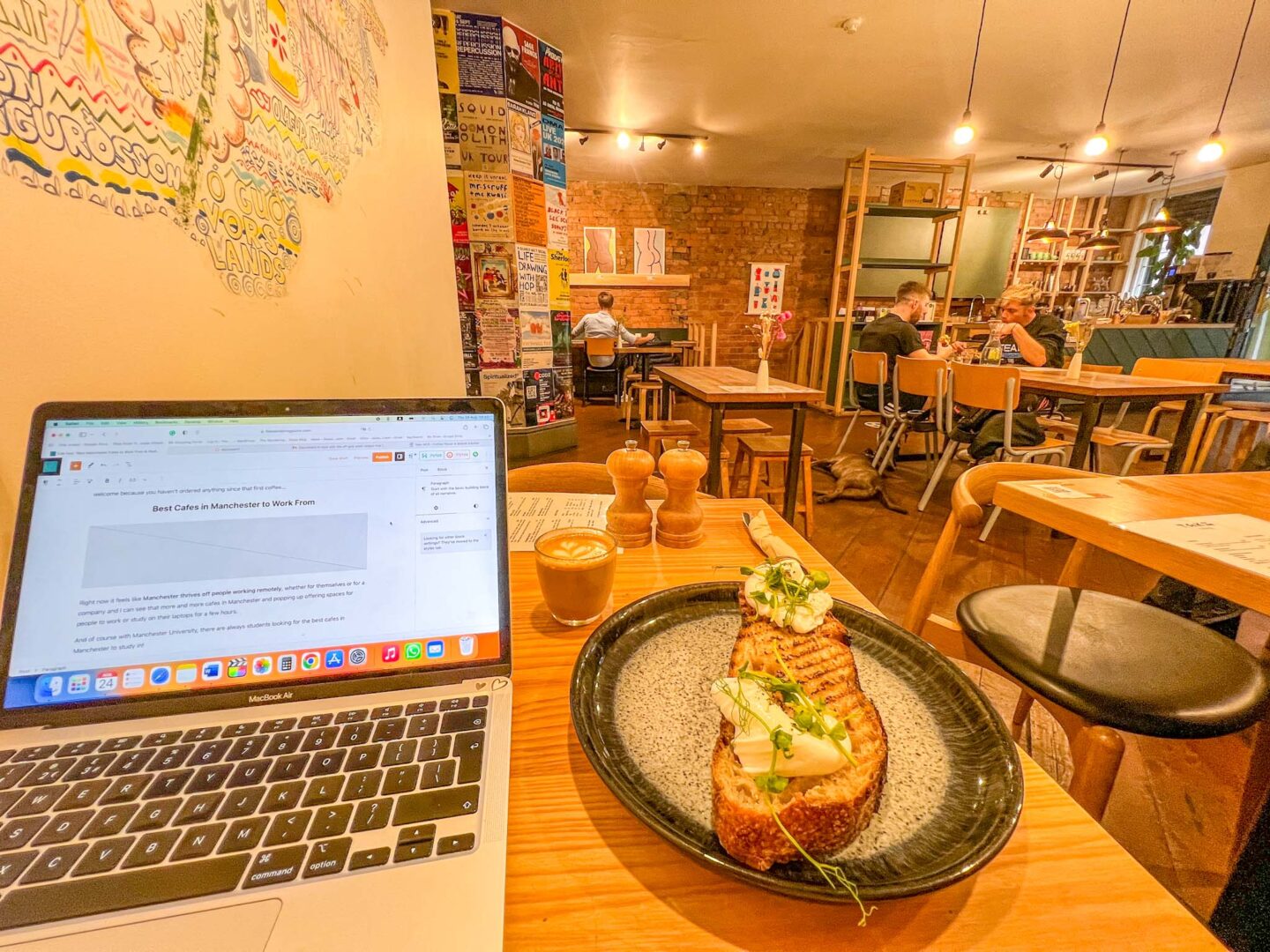 laptop, breakfast and tables showing in Takk Cafe Manchester, Manchester cafes to work from, 