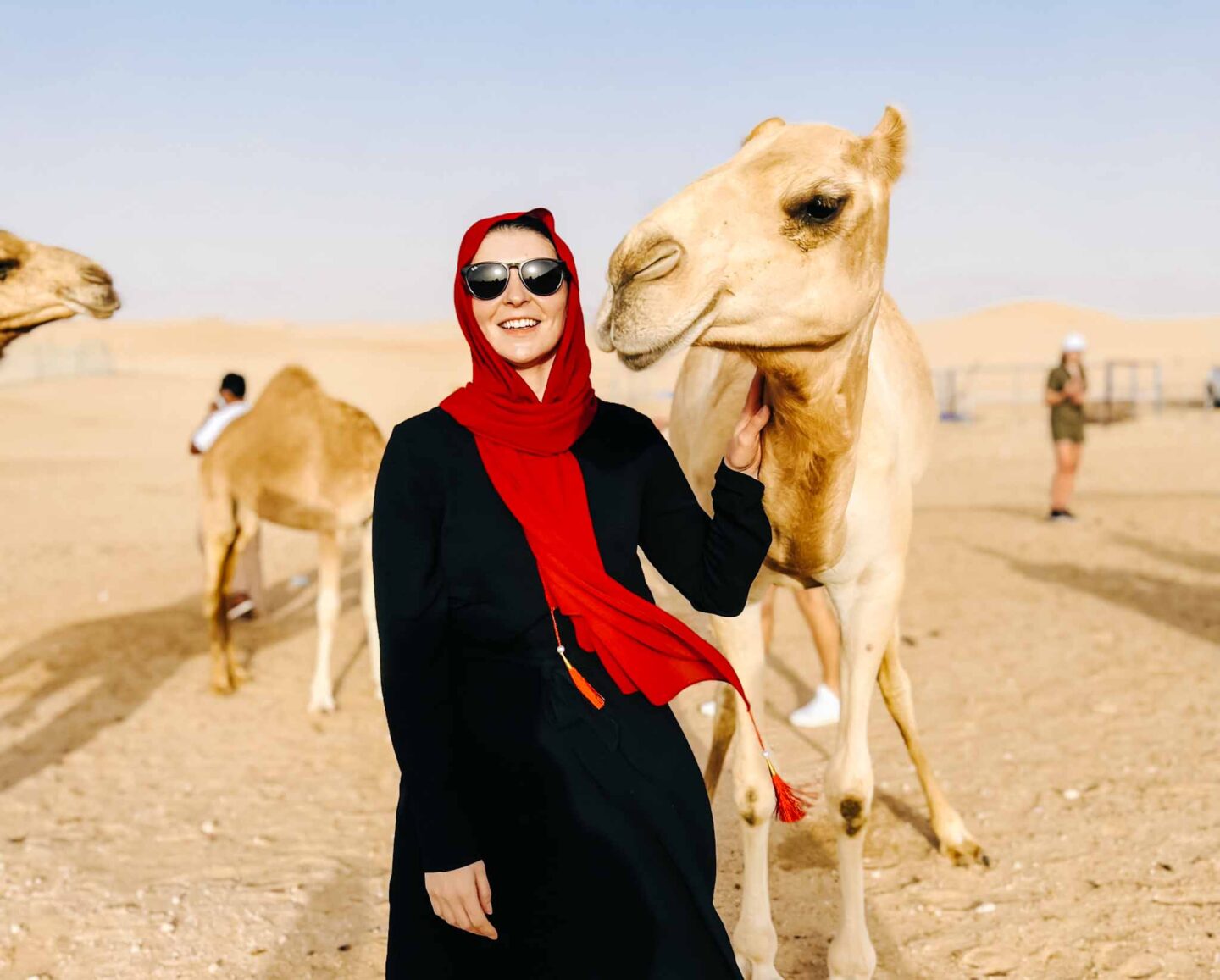 best excursions from Dubai, Ellie with camel in Dubai desert