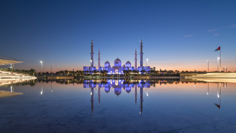 Sheikh Zayed Mosque with water and sunset, visiting Sheikh Zayed Mosque