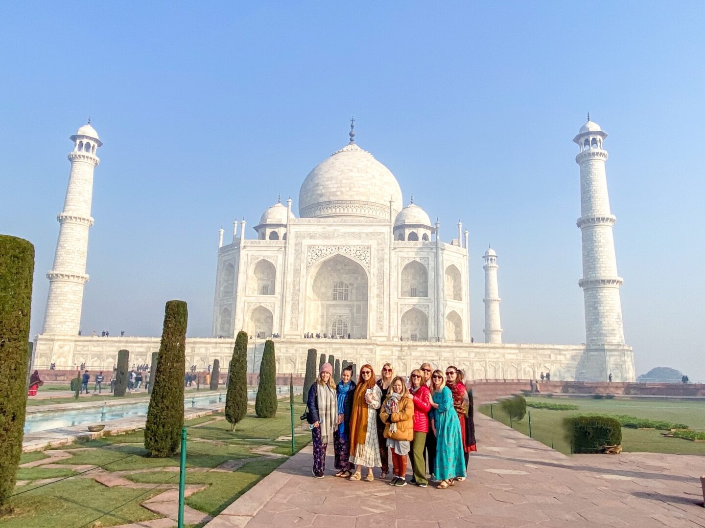 what to wear in india, female tourists at Taj Mahal in bright clothing