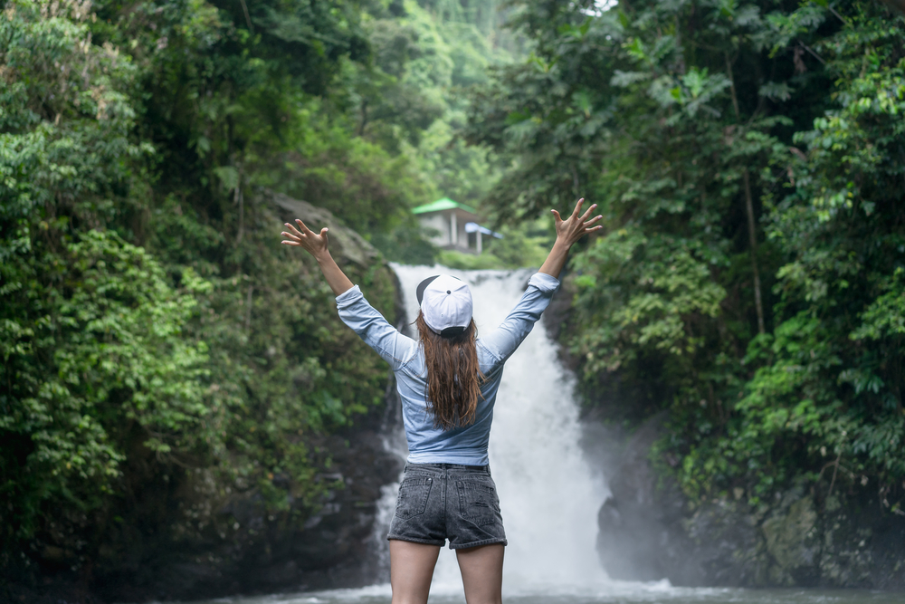 Packing List Bali, woman in activewear in Bali at waterfall