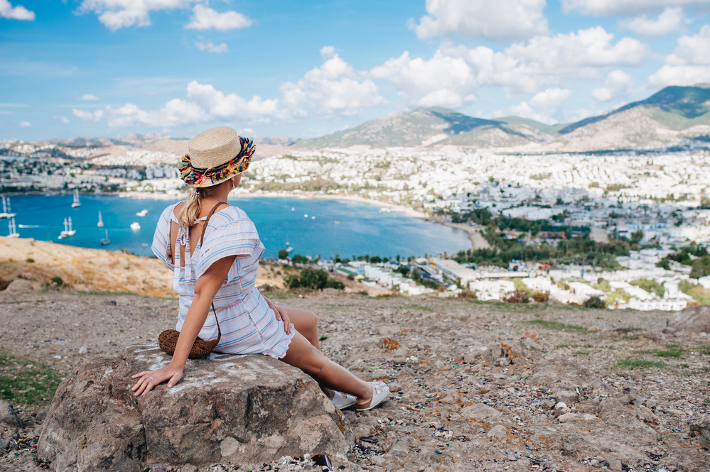 what to wear in Turkey, woman in white dress overlooking Bodrum