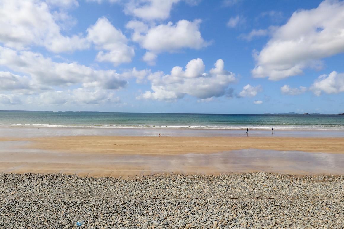 best beaches in South Wales, view of Newgate Beach with rocks, sand and water
