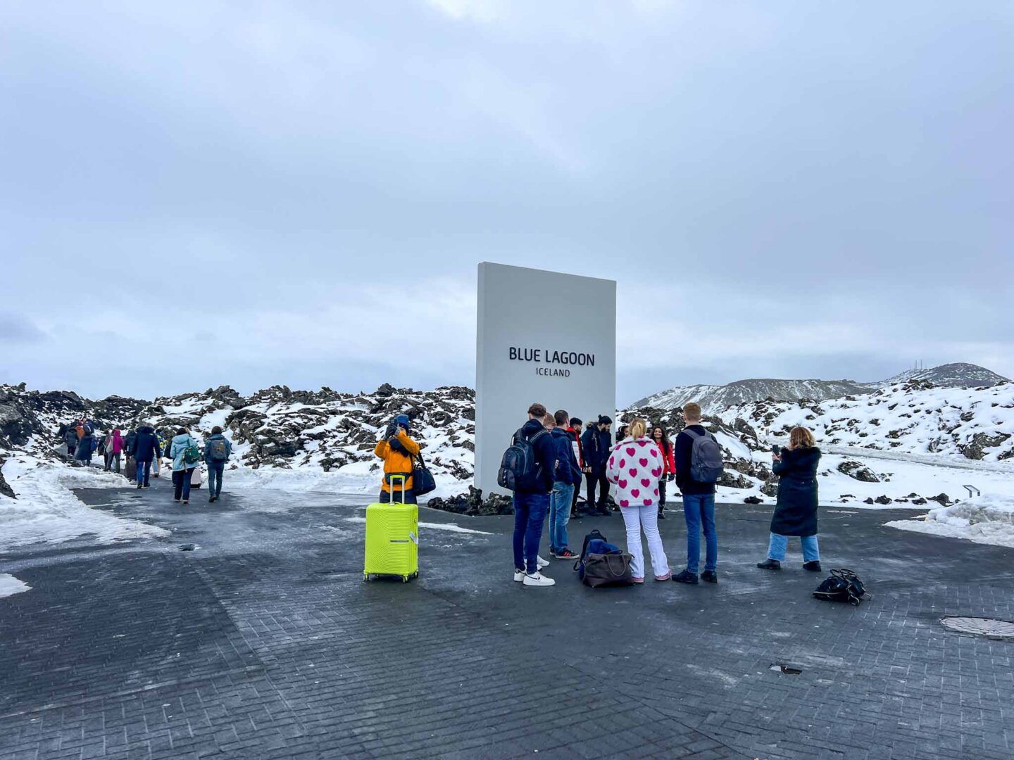 The Wandering Quinn Travel Blog what to wear in Iceland in winter, tourists outside Blue Lagoon wearing winter clothes