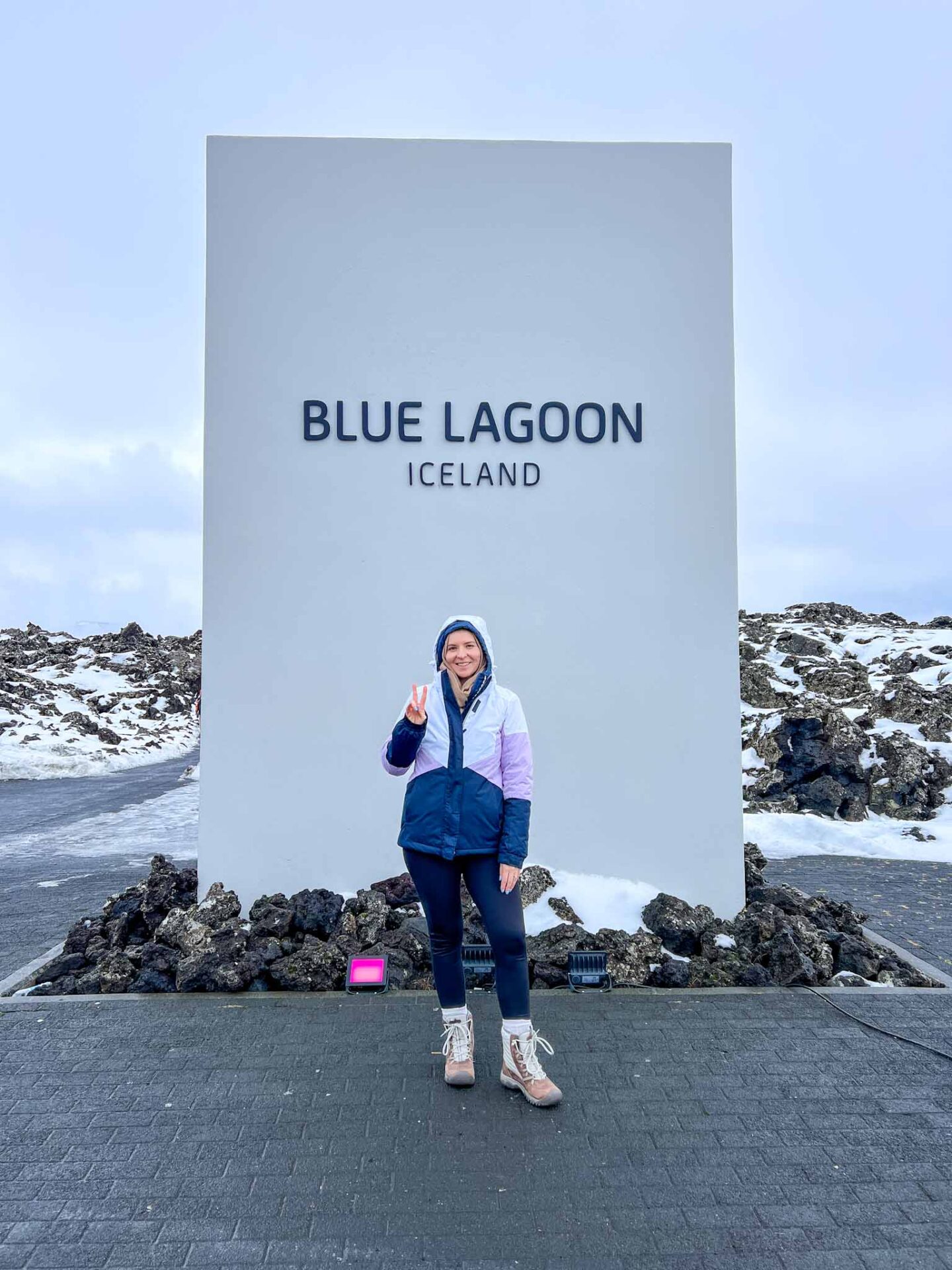 The Wandering Quinn Travel Blog Visiting the Blue Lagoon, ellie with the blue lagoon sign