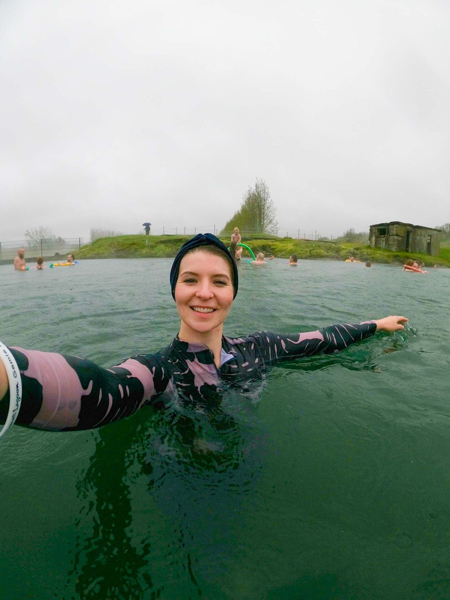 The Wandering Quinn Travel Blog Halal Food Reykjavik, ellie in modest swimwear at pool in iceland