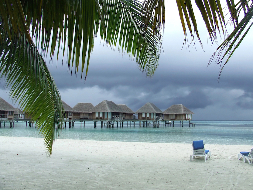 Best countries to visit in August, cloudy beach scenes in the Maldives 