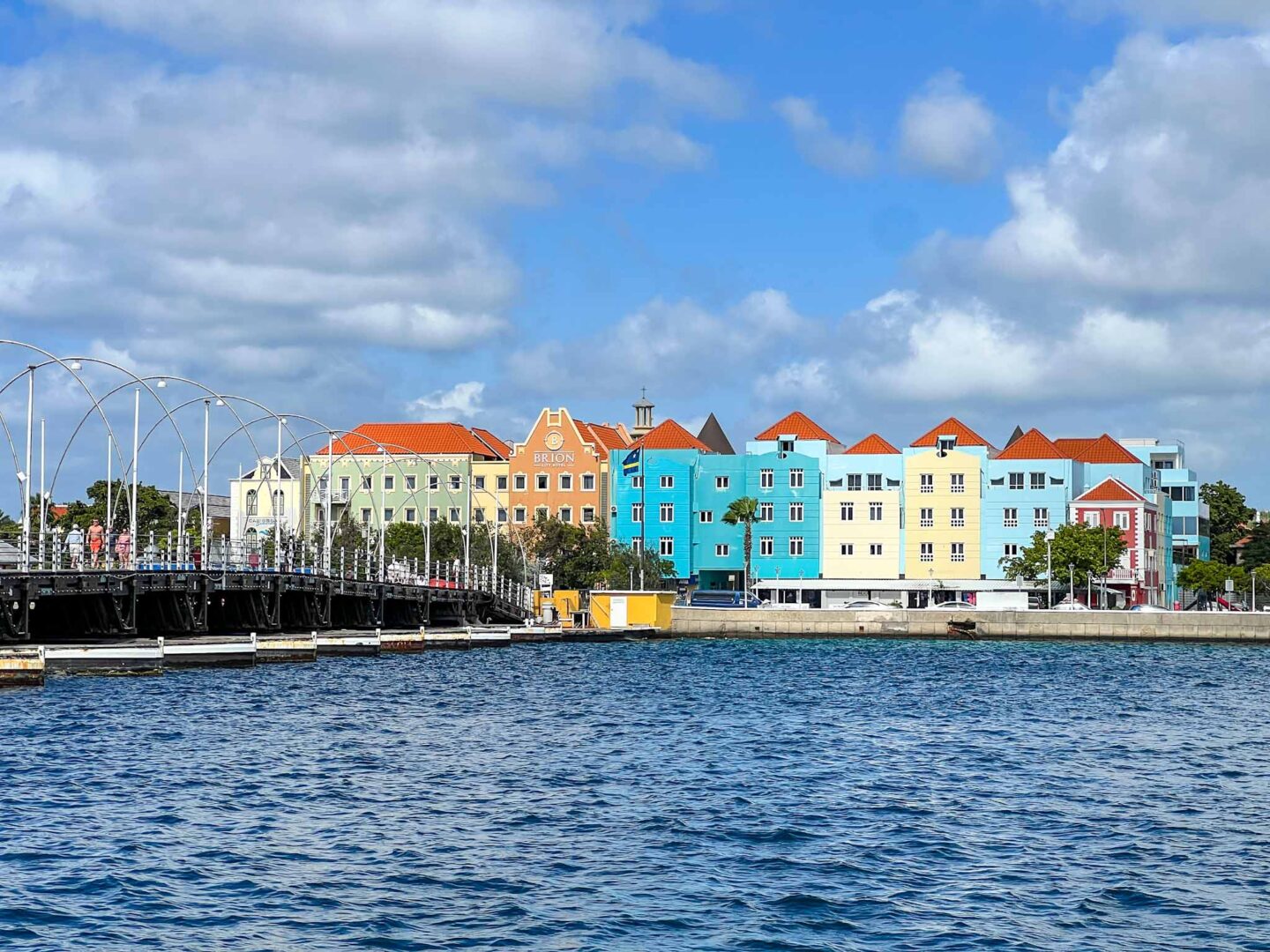 The Wandering Quinn Travel Blog how to see islands on a Caribbean cruise, Queen Emma Bridge Willemtsad Curacao colourful buildings, 