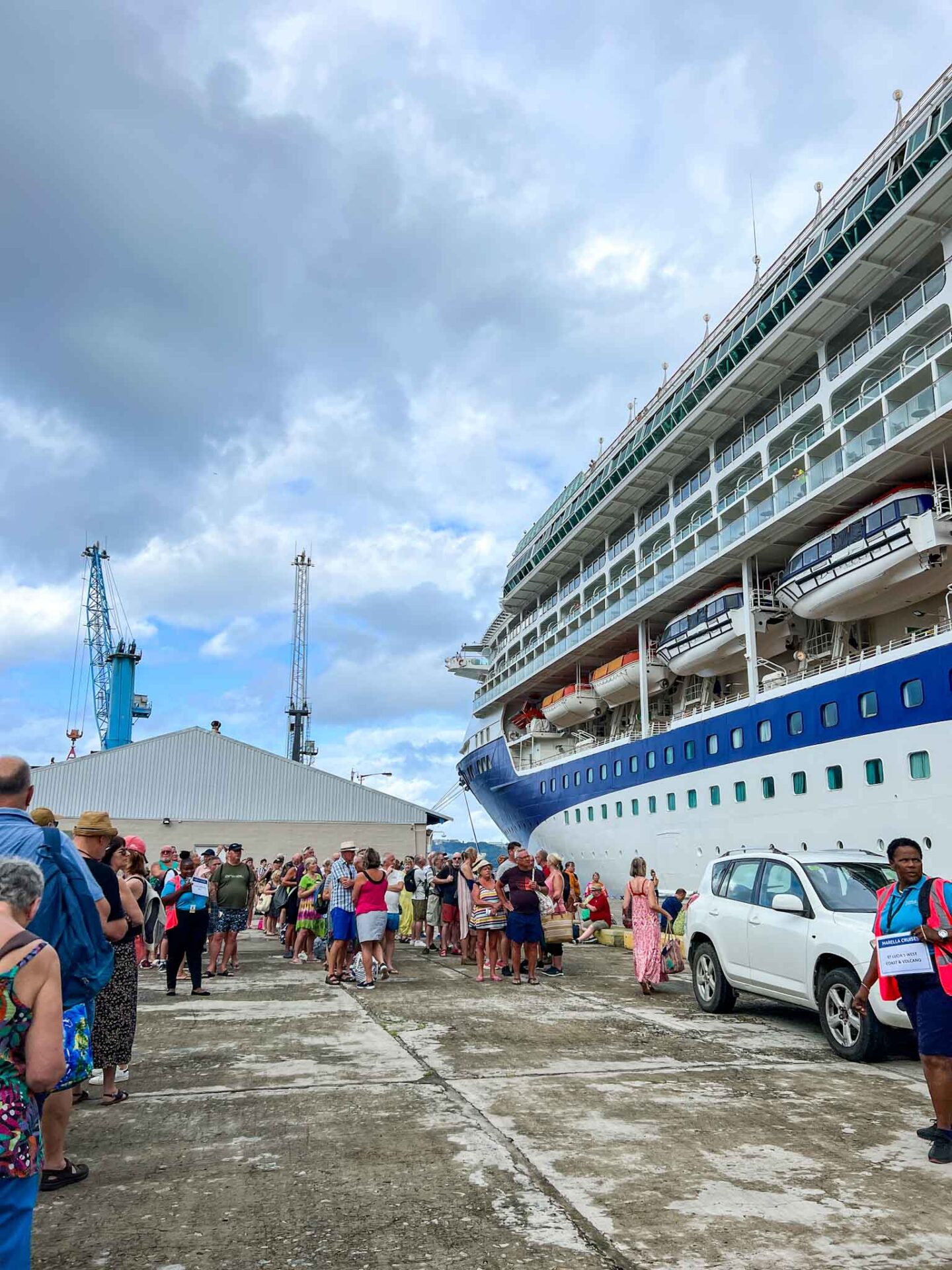 The Wandering Quinn Travel Blog Tui cruise review, guests waiting outside Marella Discovery 2 for morning excursions to start 