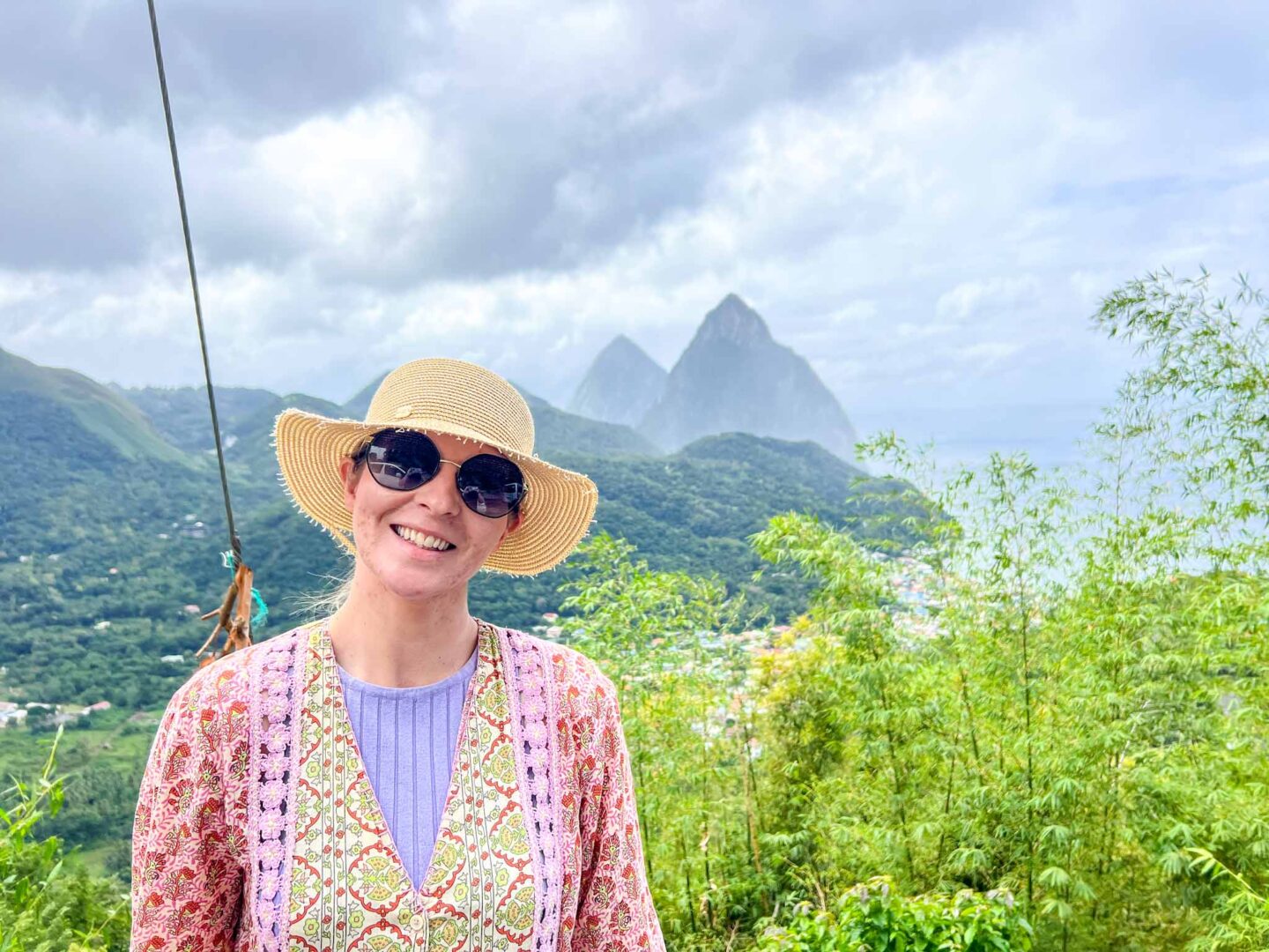 The Wandering Quinn Travel Blog how to see islands on a Caribbean cruise, Ellie in St Lucia with Pitons behind