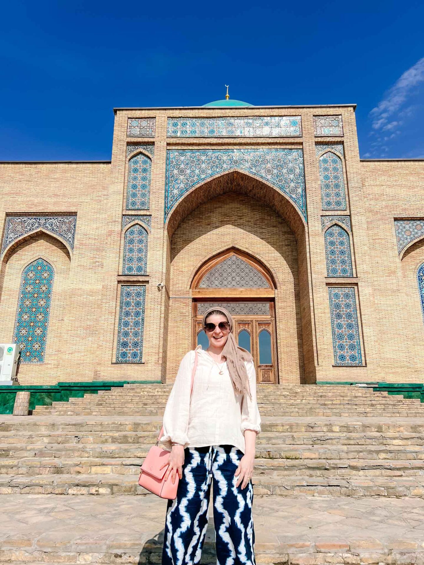 The Wandering Quinn Travel Blog What to wear Uzbekistan,  Ellie outside Tashkent mosque in light linen clothes