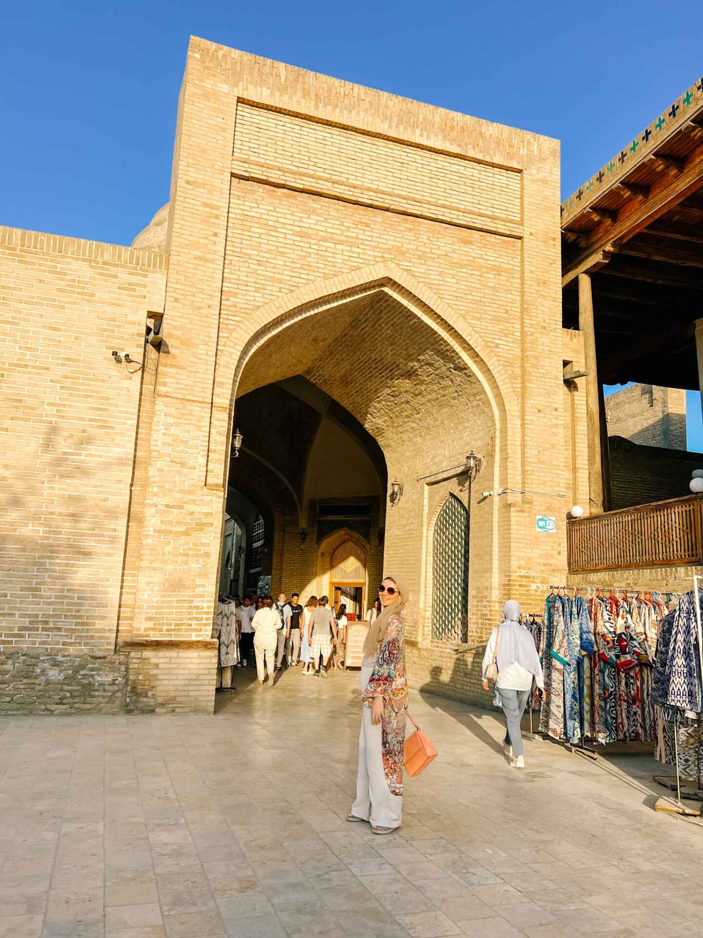 The Wandering Quinn Travel Blog What to wear Uzbekistan,  Ellie in old streets of Bukhara