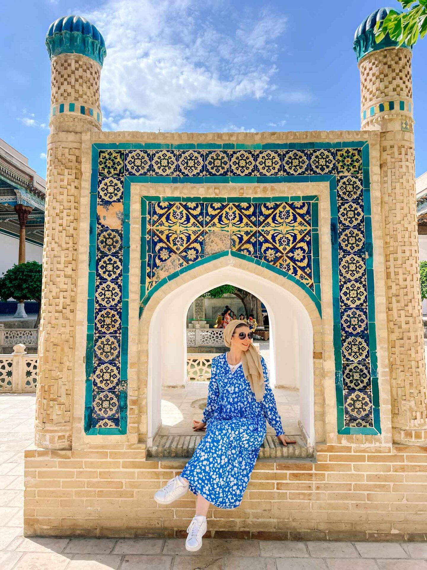The Wandering Quinn Travel Blog halal travel in Uzbekistan,  Ellie in uzbekistan in blue print dress