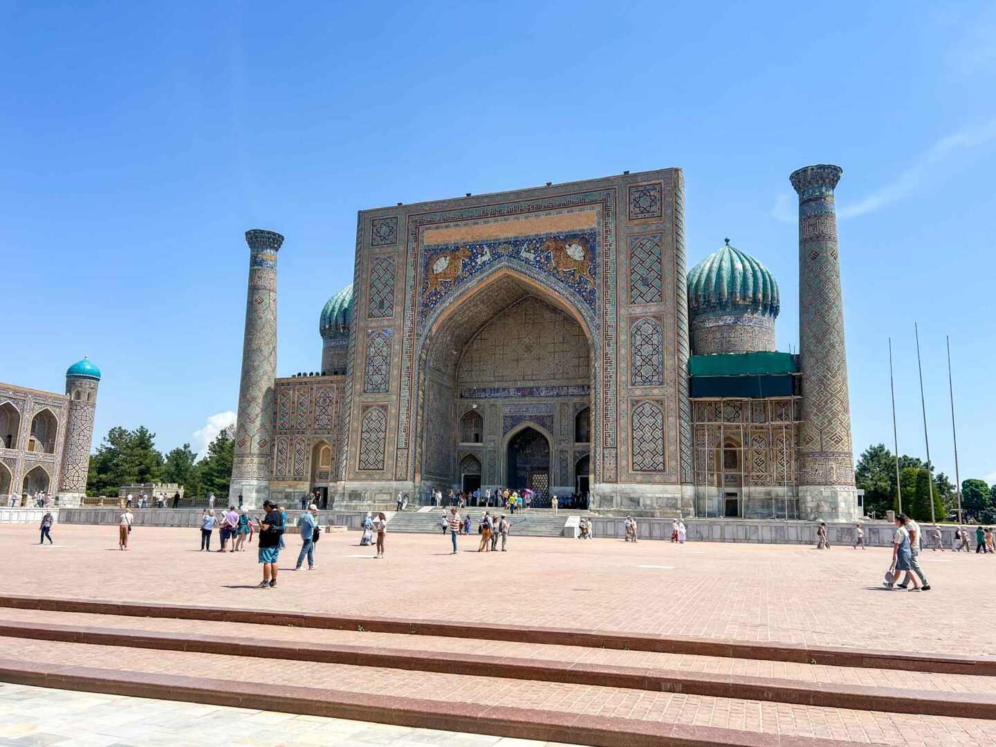 The Wandering Quinn Travel Blog What to wear Uzbekistan, tourists walking around Registan Square Samarkand