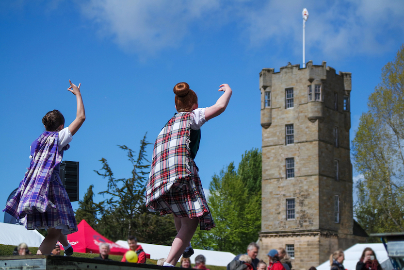 The Wandering Quinn Travel Blog things to do in the Scottish Highlands, people performing at Highland Games in Scotland 