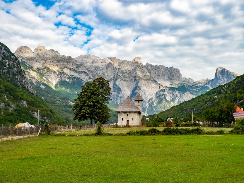 The Wandering Quinn Travel Blog one day in Theth Albania, Theth Church in fields