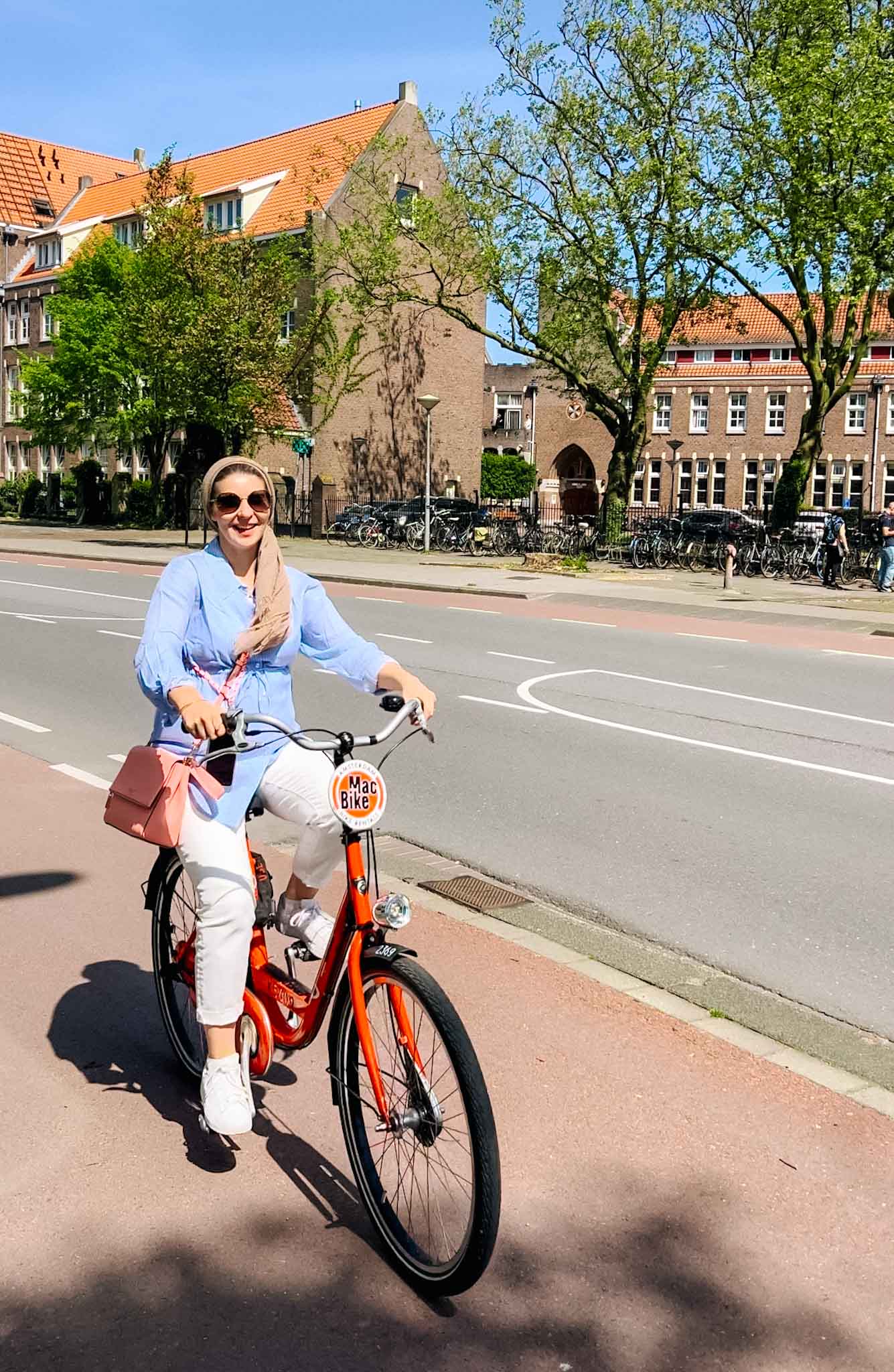 The Wandering Quinn Travel Blog Things to do in Amsterdam Noord, Ellie on bike in Amsterdam Noord