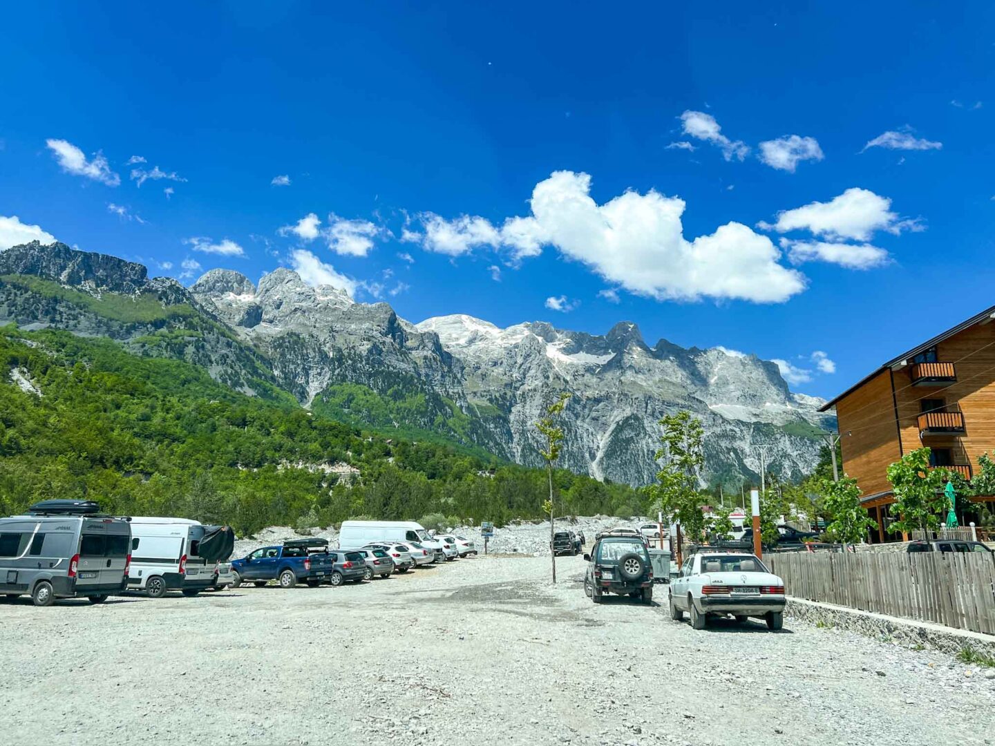 The Wandering Quinn Travel Blog one day in Theth Albania,  cars parked in Theth village