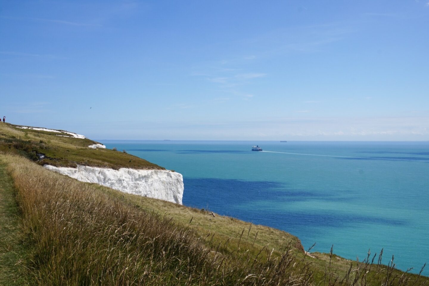 The Wandering Quinn Travel Blog white cliffs of dover views on sunny day with blue water