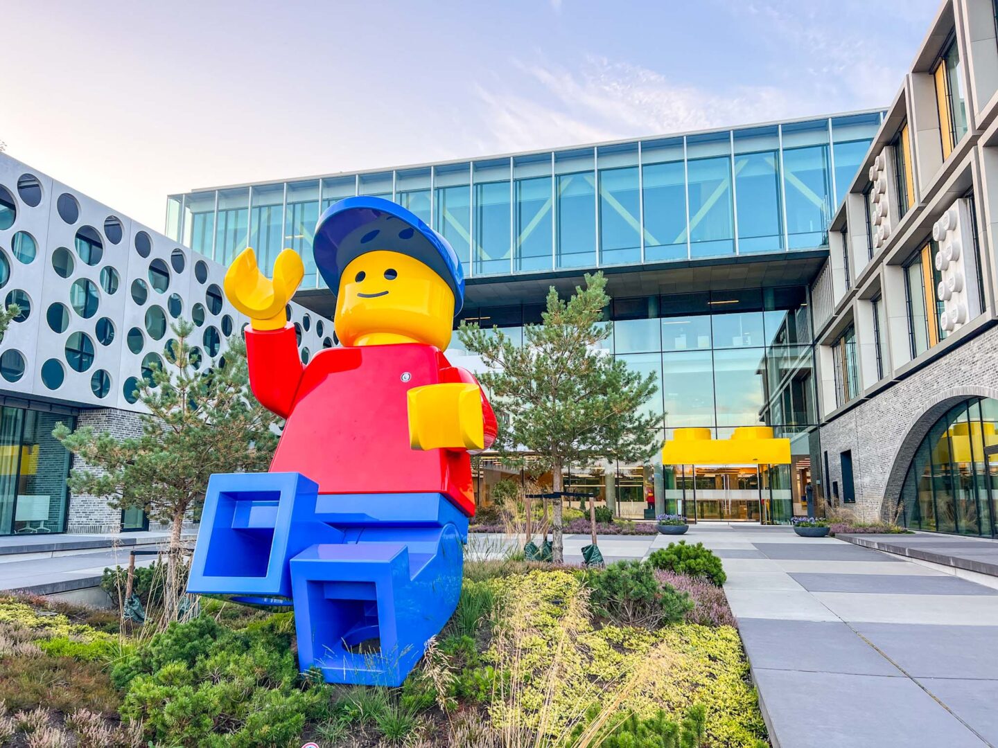 The Wandering Quinn Travel Blog things to do in Billund, LEGO man outside LEGO offices