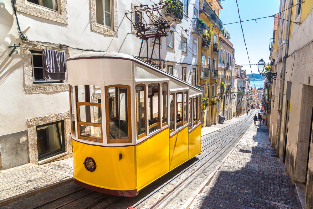 best places to go in June europe, Tram in Lisbon streets 