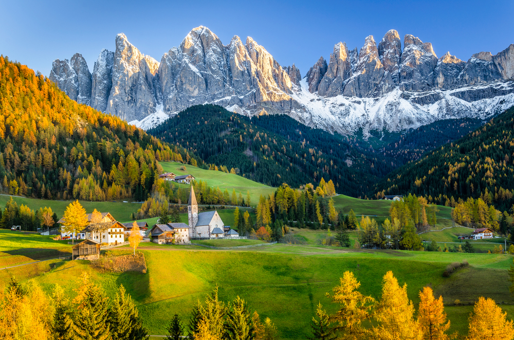 best countries to visit in October, view of Dolomites in Italy in autumn October colour